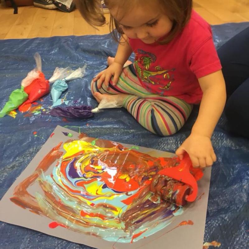 Little Learners child finger painting
